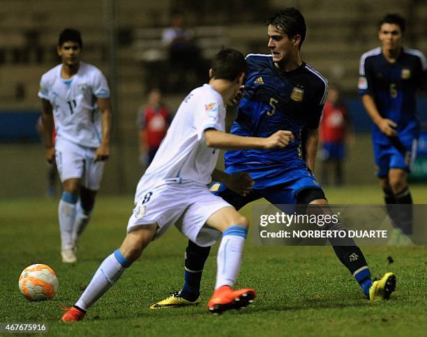Uruguay's player Diego Valverde vies for the ball with Argentina's Julian Chicco during their U-17 South American final round football match at Dr...