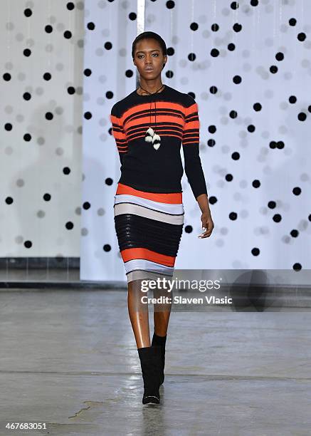 Model walks the runway at the Tanya Taylor fashion show during Mercedes-Benz Fashion Week Fall 2014 at Industria Studios on February 7, 2014 in New...