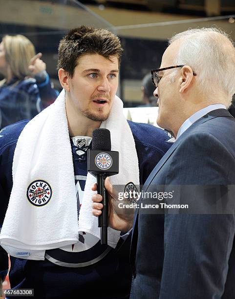 Mark Scheifele of the Winnipeg Jets answers questions during a post-game interview with Hockey Night In Canada reporter Scott Oake following a 3-0...