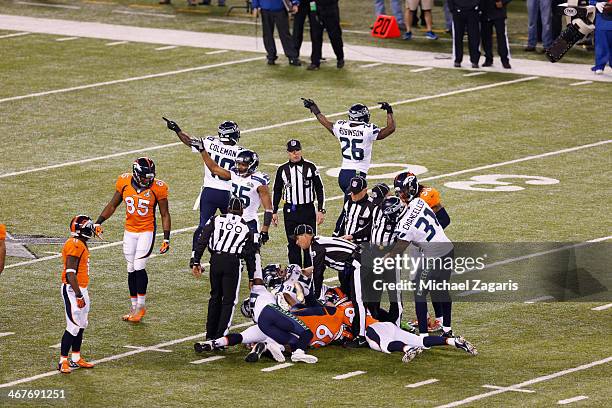 The Seattle Seahawks recover a fumble by Trindon Holliday of the Denver Broncos during Super Bowl XLVIII against at MetLife Stadium on February 2,...