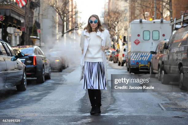 Olga Sorokina is seen around Upper East Side wearing IRFE coat, Michael Kors sweater, Christopher Kane skirt, Khaleda Rajab + Fahad Almarzouq...