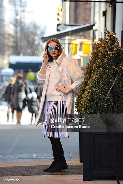 Olga Sorokina is seen around Upper East Side wearing IRFE coat, Michael Kors sweater, Christopher Kane skirt, Khaleda Rajab + Fahad Almarzouq...