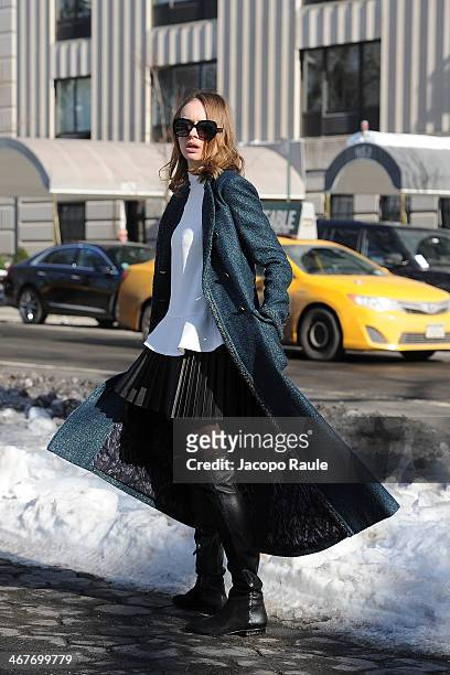 Olga Sorokina is seen around Upper East Side wearing Chanel coat, Stella McCartney top, HM skirt, Alexandre Birman boots and Bottega Veneta...