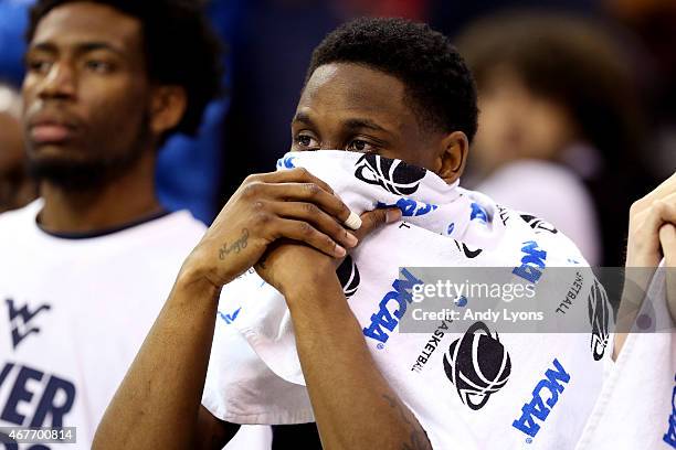 Juwan Staten of the West Virginia Mountaineers looks on from the bench late in the game against the Kentucky Wildcats during the Midwest Regional...