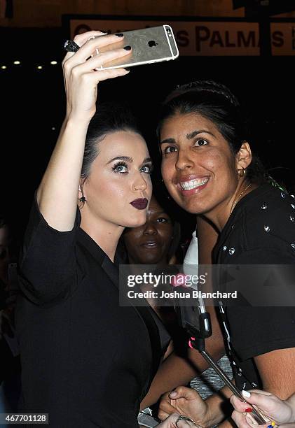 Singer-songwriter Katy Perry poses with fans during EPIX and Time Warner Cable World Premier Screening Of "Katy Perry: The Prismatic World Tour" at...