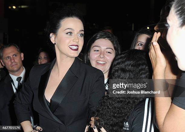 Singer-songwriter Katy Perry poses with fans during EPIX and Time Warner Cable World Premier Screening Of "Katy Perry: The Prismatic World Tour" at...