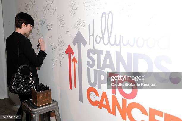 Actress Anne Hathaway attends Hollywood Stands Up To Cancer Event with contributors American Cancer Society and Bristol Myers Squibb hosted by Jim...