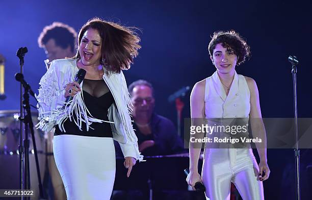 Gloria Estefan and daughter, Emily Estefan on stage during the Miami Beach 100 Centennial Concert on March 26, 2015 in Miami Beach, Florida.