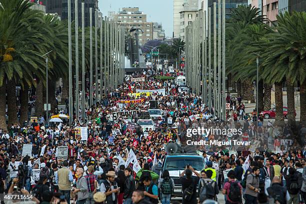 Demonstrators and relatives of the missing students of Ayotzinapa college march during a rally to ask Mexican authorities to continue the search for...