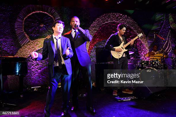 Actors Jamie Foxx and Ken Jeong perform onstage at Hollywood Stands Up To Cancer Event with contributors American Cancer Society and Bristol Myers...