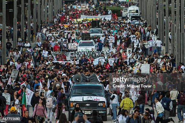 Demonstrators and relatives of the missing students of Ayotzinapa college march during a rally to ask Mexican authorities to continue the search for...