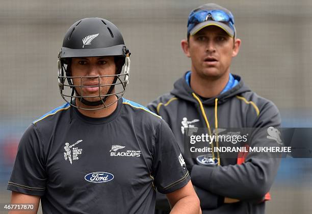 New Zealand cricketer Ross Taylor and bowling coach Shane Bond look on during a training session at the Melbourne Cricket Ground , ahead the 2015...