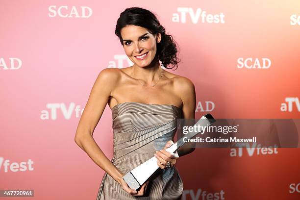 Actress Angie Harmon poses with the Spotlight Award at SCAD's aTVfest on February 7, 2014 in Atlanta, Georgia.