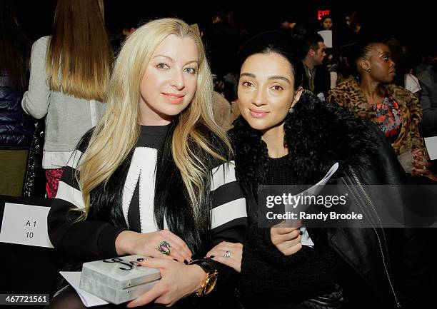 Guests attend the Academy Of Art University Fall 2014 Collections show during Mercedes-Benz Fashion Week at The Theatre at Lincoln Center on February...