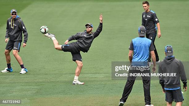 New Zealand's Kane Williamson kicks the ball while playing football during a training session at the Melbourne Cricket Ground on March 27, 2015 ahead...