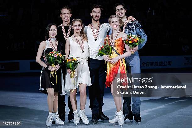 Second place winners Madison Chock and Evan Bates of United States, First place winners Gabriella Papadakis and Guillaume Cizeron of France and Third...