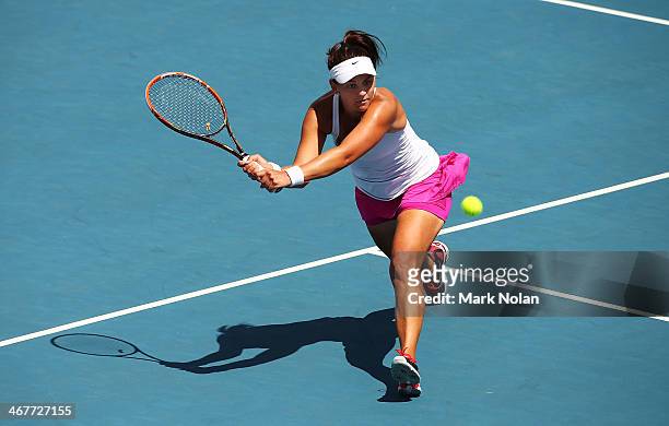 Casey Dellacqua of Australia plays a backhand in her singles match against Irina Khromacheva of Russia during the Fed Cup tie between Australia and...