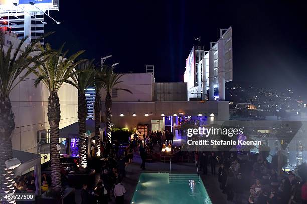 Guests mingle by the rooftop pool at the after party for the Opening Night Gala and screening of The Sound of Music during the 2015 TCM Classic Film...