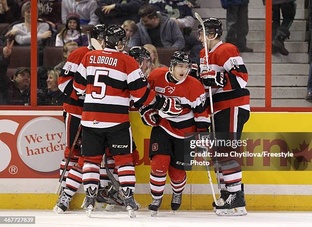 Travis Konecny of the Ottawa 67's celebrates his first-period goal against the Sarnia Sting with teammates Adrian Sloboda, Ryan Van Stralen and Alex...