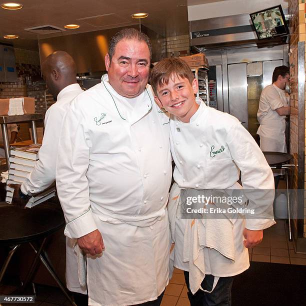 Chef Emeril Lagasse pauses for a photo in the kitchen with his 12 year old son, EJ Lagasse, during the 25th Anniversary celebration at Emeril's on...