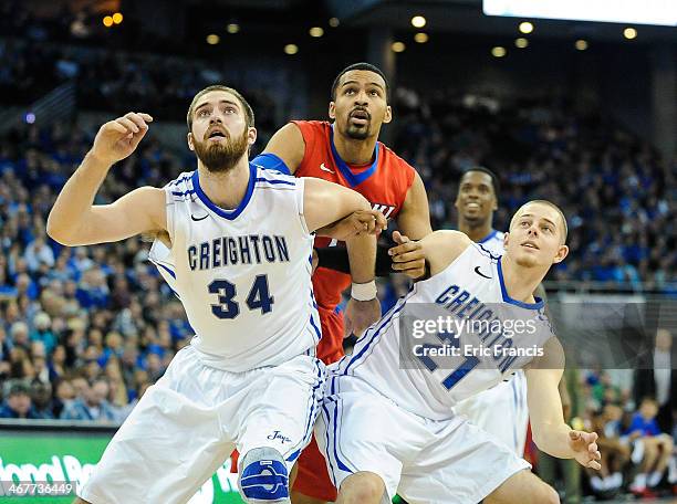 Isaiah Zierden and Ethan Wragge of the Creighton Bluejays box out DeJuan Marrero of the DePaul Blue Demons during their game at CenturyLink Center on...