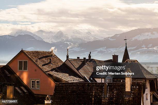 rapperswil rooftops in front of mountain range - st gallen canton stock pictures, royalty-free photos & images