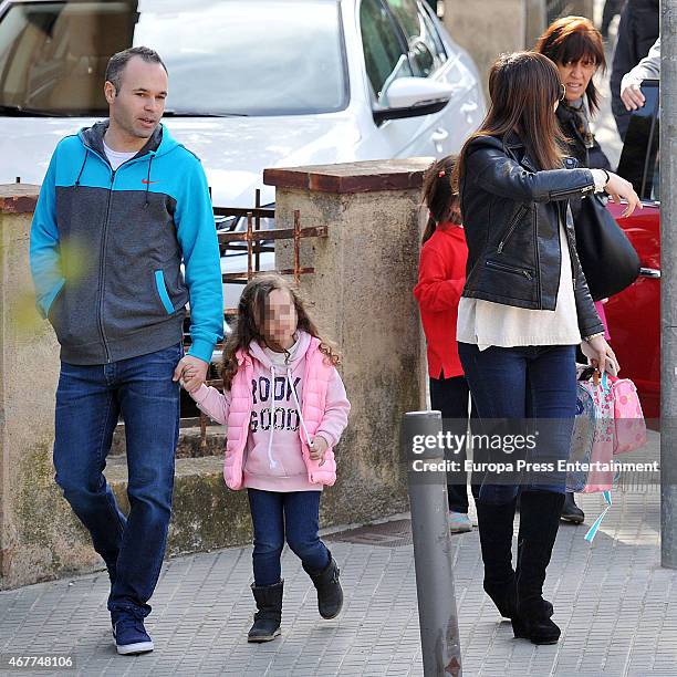 Barcelona football player Andres Iniesta, his wife Anna Ortiz and their daughter Valeria Ortiz are seen on March 09, 2015 in Barcelona, Spain.