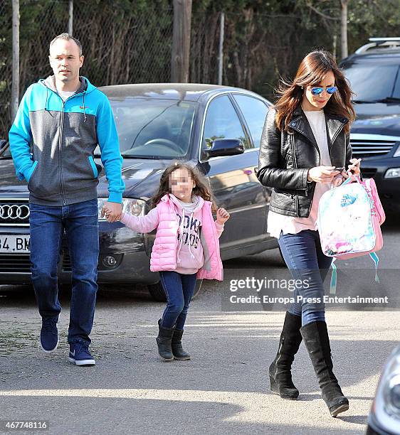 Barcelona football player Andres Iniesta, his wife Anna Ortiz and their daughter Valeria Ortiz are seen on March 09, 2015 in Barcelona, Spain.