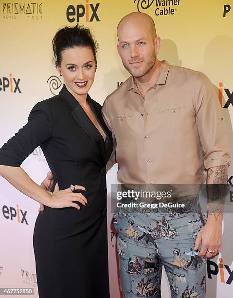 Singer Katy Perry and costume designer Johnny Wujek arrive at the World Premiere of EPIX's "Katy Perry: The Prismatic World Tour" at The Ace Hotel...