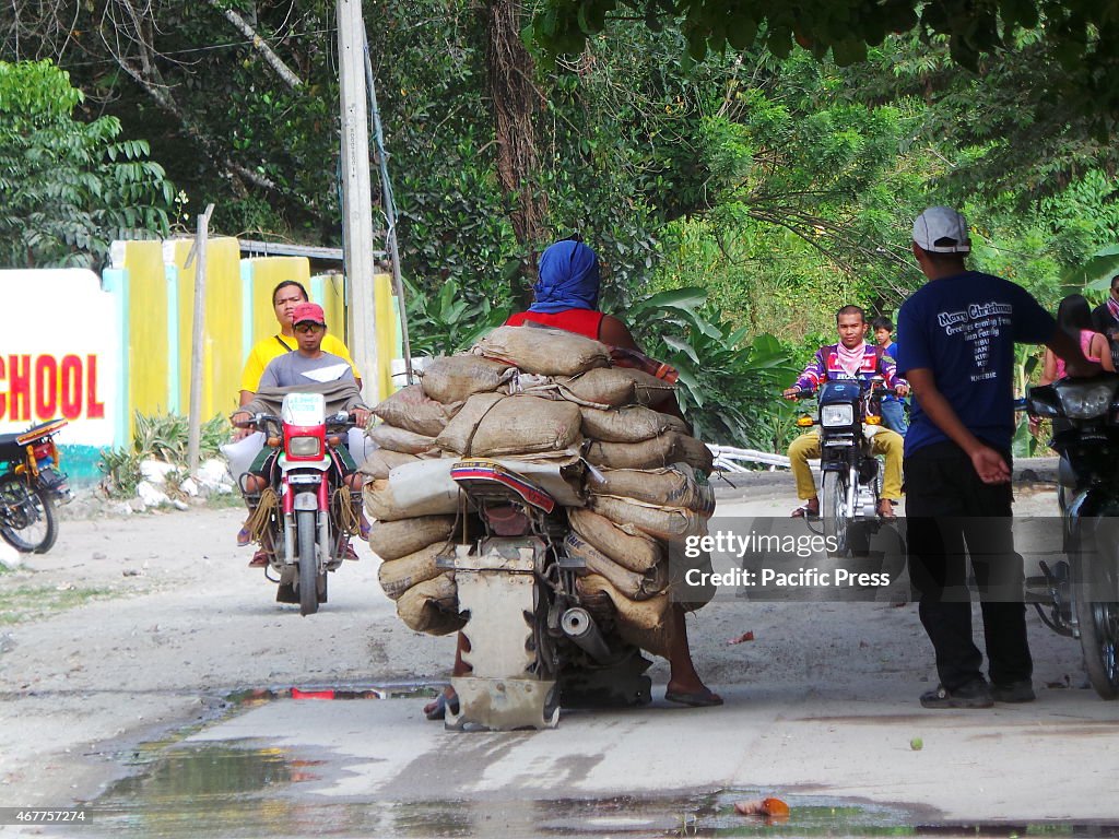 A motorcycle loaded with sacks of rocks (with possible gold...