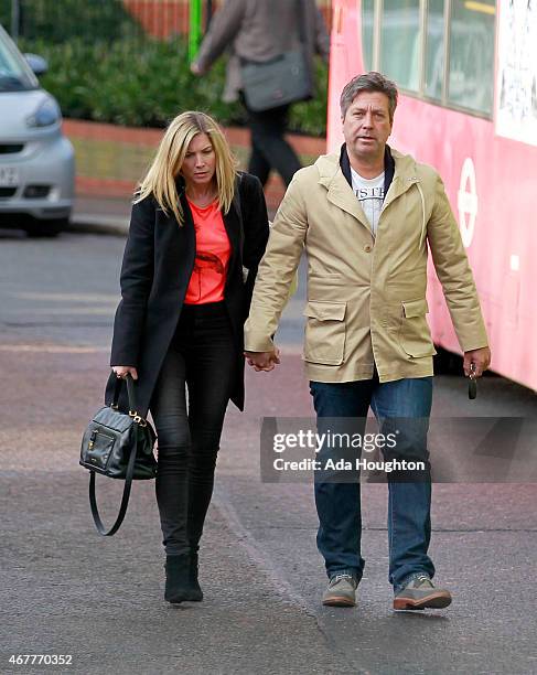 MasterChef Judge John Torode is pictured walking hand in hand with actress girlfriend Lisa Faulkner on March 24, 2015 in London, England.