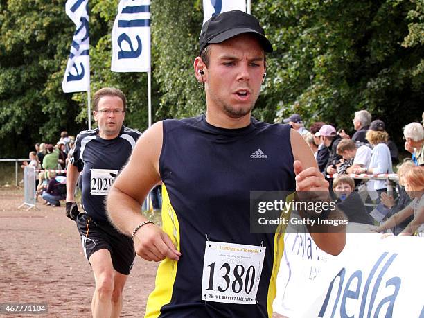 In this photo released today, co-pilot of Germanwings flight 4U9525 Andreas Lubitz participates in the Airport Hamburg 10-mile race on September 13,...