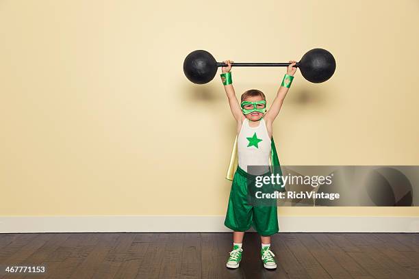 superhero training - young kid and barbell bildbanksfoton och bilder