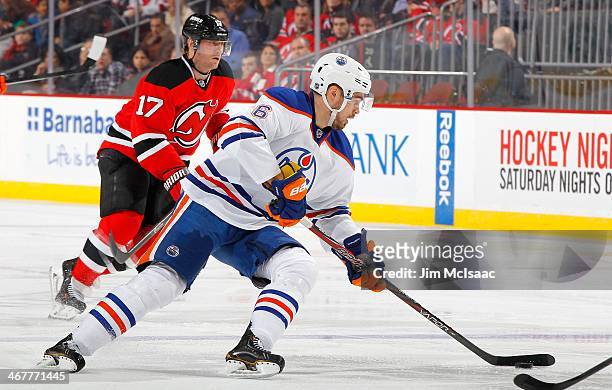 Jesse Joensuu of the Edmonton Oilers in action against the New Jersey Devils at the Prudential Center on February 7, 2014 in Newark, New Jersey. The...