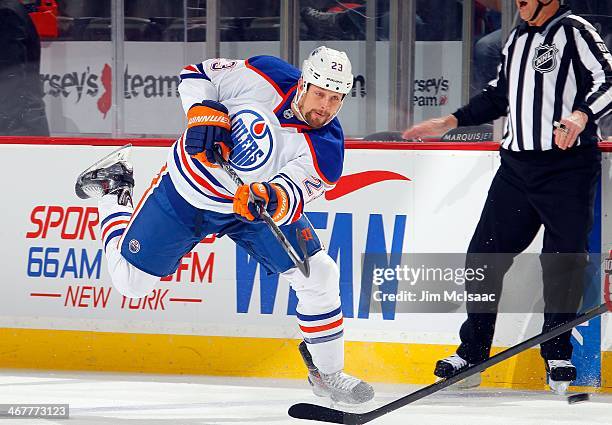 Matt Hendricks of the Edmonton Oilers in action against the New Jersey Devils at the Prudential Center on February 7, 2014 in Newark, New Jersey. The...