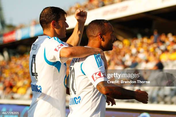 Archie Thompson of the Victory celebrates with team mate James Troisi after scoring during the round 18 A-League match between the Central Coast...