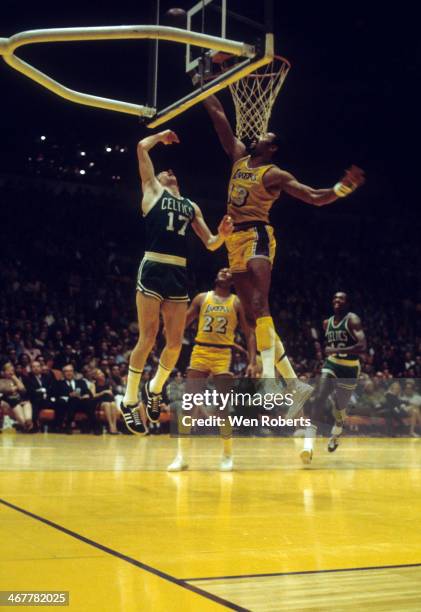 Wilt Chamberlain of the Los Angeles Lakers tries to block the shot attempt by John Havlicek of the Boston Celtics during the 1971-1972 season at the...