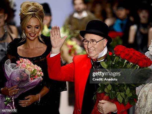 Designer Slava Zaitsev appears on the catwalk after the 2015/2016 Fall/Winter Mercedes-Benz Fashion Week Russia on March 27, 2015 in Moscow.