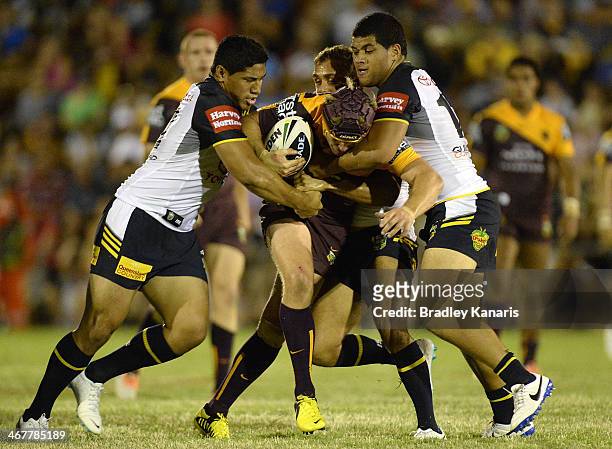 Todd Lowrie of the Broncos attempts to push through the defence during the NRL trial match between the Brisbane Broncos and the North Queensland...