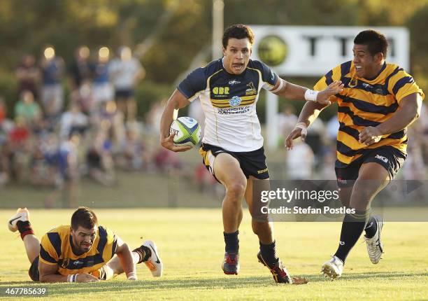 Matt Toomua of the Brumbies runs the ball during the Super Rugby trial match between the Brumbies and the ACT XV at Viking Park on February 8, 2014...