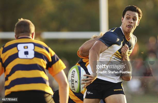 Matt Toomua of the Brumbies passes the ball during the Super Rugby trial match between the Brumbies and the ACT XV at Viking Park on February 8, 2014...