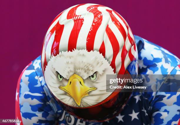 Katie Uhlaender of the United States shows a bald eagle design on her helmet as she prepares to make a run during a Women's Skeleton training session...