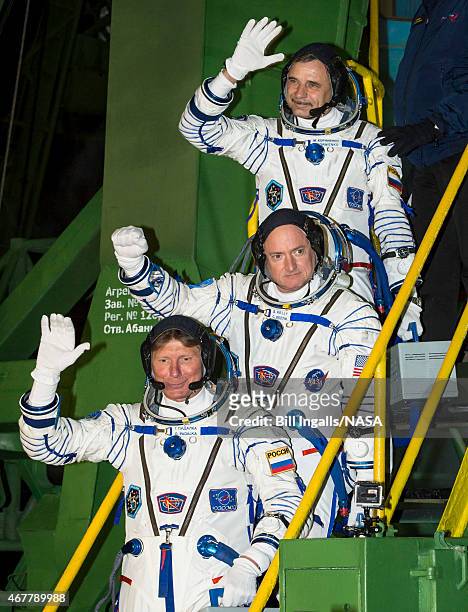 In this handout provided by NASA, Expedition 43 Russian Cosmonaut Mikhail Kornienko of the Russian Federal Space Agency , top, NASA Astronaut Scott...