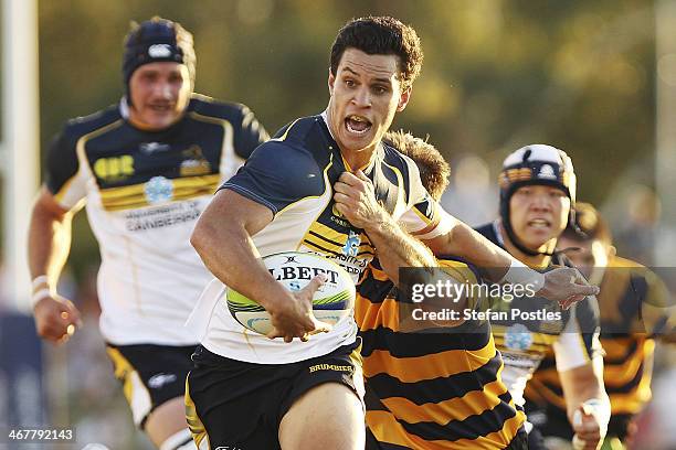 Matt Toomua of the Brumbies is tackled during the Super Rugby trial match between the Brumbies and the ACT XV at Viking Park on February 8, 2014 in...