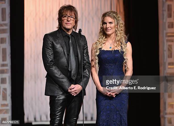 Singer Richie Sambora and actress Kelly Greyson speak on stage at the 22nd Annual Movieguide Awards Gala at the Universal Hilton Hotel on February 7,...