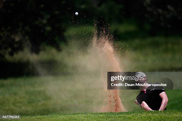 Gregory Bourdy of France hits his second shot on the 2nd hole out of the bunker during Day Three of the Joburg Open at Royal Johannesburg and...