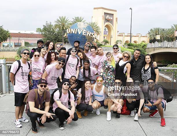 In this handout photo provided by Universal Orlando Resort, pop-superstar Ariana Grande and her Honeymoon Tour crew pose for a group photo at the...