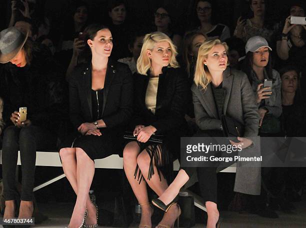 Tessa Virtue, Lee-Ann Cuthbert and Elisha Cuthbert attend World MasterCard Fashion Week Fall 2015 Collections Day 4 at David Pecaut Square on March...