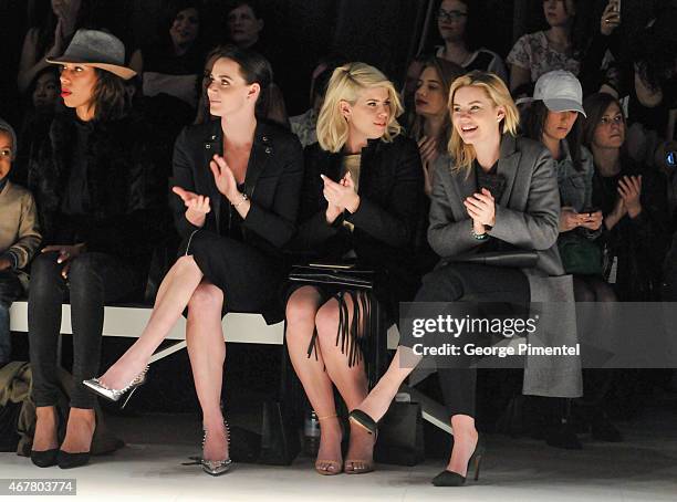 Tessa Virtue, Lee-Ann Cuthbert and Elisha Cuthbert attend World MasterCard Fashion Week Fall 2015 Collections Day 4 at David Pecaut Square on March...