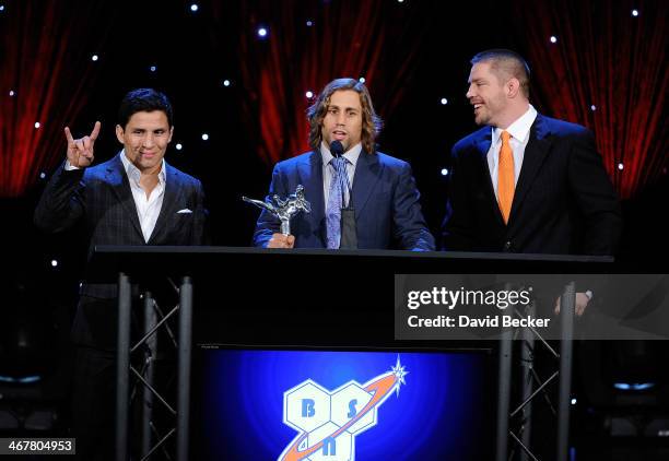 Mixed martial artists Joseph Benavidez, Urijah Faber and coach and former mixed martial artist Duane Ludwig accept the Gym of the Year award during...
